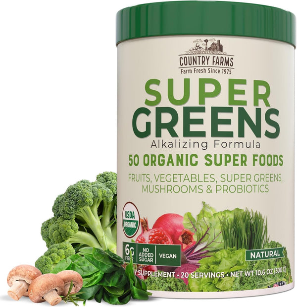 Container of Country Farms Super Greens supplement with green lid and label, surrounded by vegetables on a white background.
